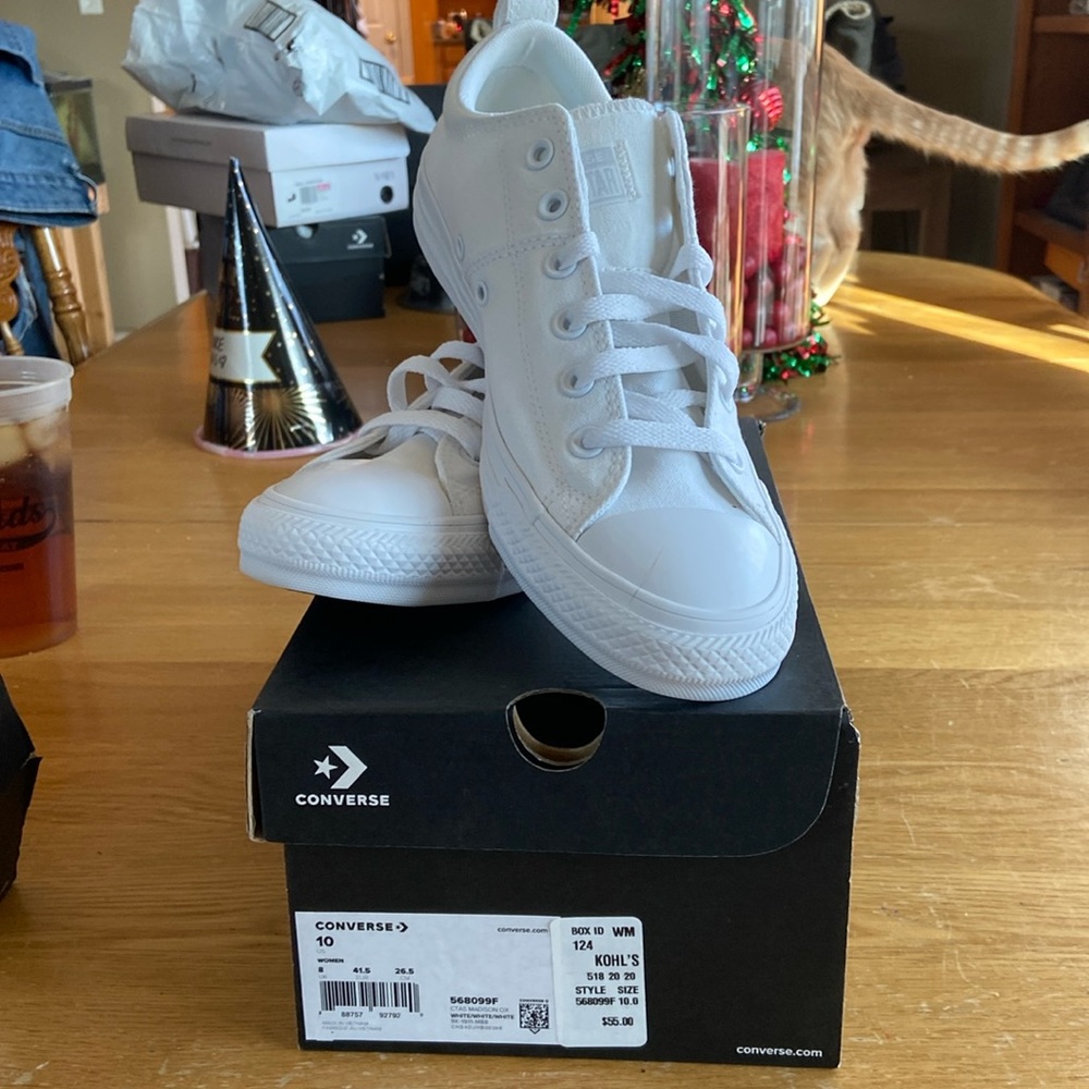 Womens Converse All Star tennis shoes.  Classic white on white